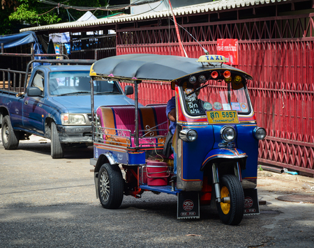 Bangkok, Thailand - Jun 15, 2016. Tuk-tuk taxis parking on road in Bangkok, Thailand. The city of Bangkok has a population of 8,280,925 (2010), or 12.6 percent of the national population.のeditorial素材