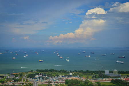 Singapore - Jun 13, 2017. Cargo boats on the sea at sunny day in Singapore. Singapore is one of the most popular travel destinations in the world for a lot of reasons.のeditorial素材