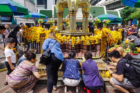 Bangkok, Thailand - Jun 20, 2017. Many people praying at Erawan Temple in Bangkok, Thailand. Erawan houses a statue of Phra Phrom, the Thai representation of the Hindu god of creation Lord Brahma.のeditorial素材