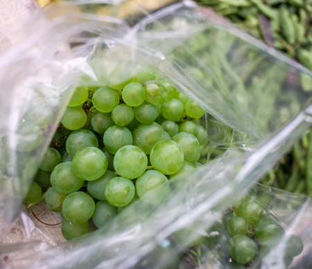 Green grapes for sale at rural market in Thimphu, Bhutan.の写真素材