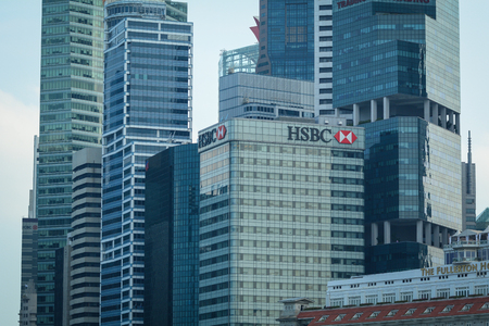 Singapore - Jul 3, 2015. Top of modern buildings at finance district in Singapore. Singapore is the...