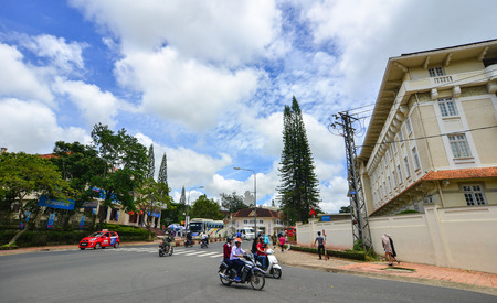 Dalat, Vietnam - Aug 19, 2017. People riding scooters on street in Dalat, Vietnam. Da Lat is a popular tourist destination, located 1,500m above sea level on the Langbian Plateau.のeditorial素材