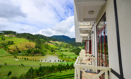 Balcony of luxury mountain resort at sunny day in Dalat, Vietnam. Da Lat is a popular tourist destination, located 1,500m above sea level on the Langbian Plateau.のeditorial素材