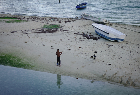 Grand Baie, Mauritius - Jan 11, 2017. People standing on beach in Mauritius. Mauritius is an island nation in the Indian Ocean about 2,000 km off the southeast coast of the African continent.のeditorial素材