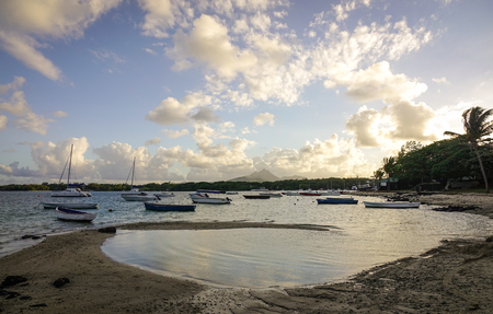 Seascape of Mauritius Island with many wooden boats at sunset. Mauritius an Indian Ocean island nation is known for its beaches lagoons and reefs.のeditorial素材