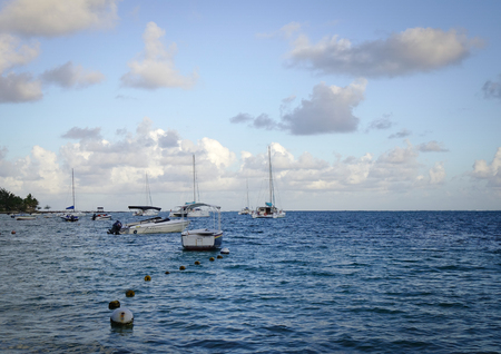 Grand Baie, Mauritius - Jan 11, 2017. Speedboats docking at Grand Baie in Mauritius. Mauritius enjoys a tropical climate with clear warm sea waters, beaches and cultural population.のeditorial素材