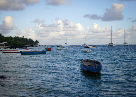 Grand Baie, Mauritius - Jan 11, 2017. Wooden boats docking at Grand Baie in Mauritius. Mauritius enjoys a tropical climate with clear warm sea waters, beaches and cultural population.のeditorial素材
