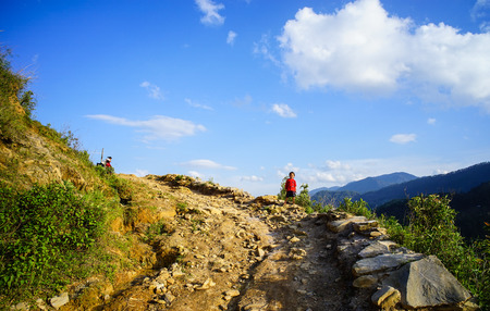 Lao Cai, Vietnam - May 28, 2016. A boy walking on rural road in Lao Cai, Vietnam. Lao Cai and Sa Pa are two important cities within the province at the border with China.のeditorial素材
