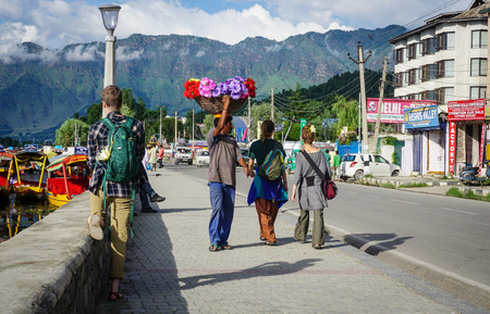 Srinagar, India - Jul 23, 2015. People walking on street at sunny day in Srinagar, India. Srinagar, the summer capital of Jammu & Kashmir, is as beautiful as it is politically unstable.のeditorial素材