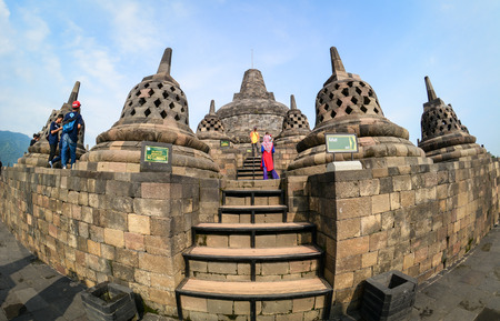 Java, Indonesia - Apr 15, 2016. People visit Borobudur Temple on Java, Indonesia. The Borobodur Temple complex is one of the greatest monuments in the world.のeditorial素材