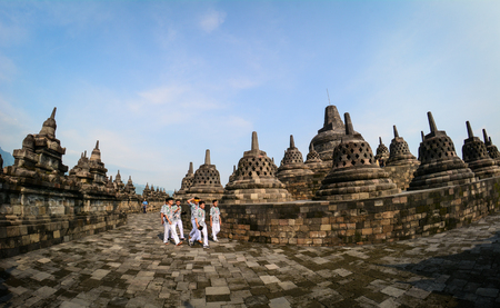 Java, Indonesia - Apr 15, 2016. Students visit Borobudur Temple on Java, Indonesia. The Borobodur Temple complex is one of the greatest monuments in the world.のeditorial素材