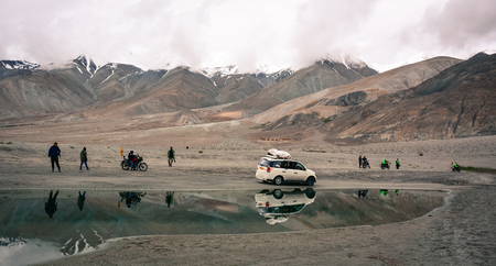 Ladakh, India - Jul 21, 2015. People visit Pangong Lake in Ladakh, India. Situated at a height of 4250 meters, Pangong Tso is one of the largest brackish lakes in Asia.のeditorial素材