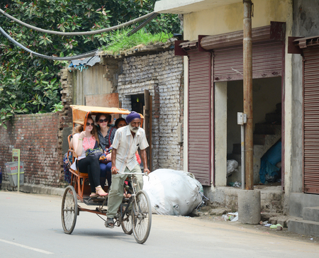 Amritsar, India - Jul 25, 2015. A man riding rickshaw in Amritsar, India. Amritsar is a holy city in the state of Punjab in India. It lies about 25 km east of the border with Pakistan.のeditorial素材