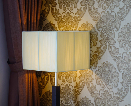 Elegant lamp with yellow light at living room of modern house.の写真素材