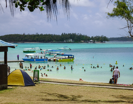 Grand Baie, Mauritius - Jan 15, 2017. People enjoying on beach in Grand Baie, Mauritius Island. Mauritius (Maurice, Moris) is a small, multi-cultural island in the Indian Ocean.のeditorial素材