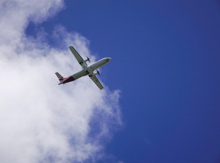Mahebourg, Mauritius - Jan 15, 2017. A civil airplane flying away to the blue sky in Mauritius....