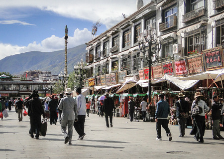 Tibet, China - Sep 7, 2012. People walk around Jokhang temple in Tibet. Jokhang Temple is the spiritual center of Tibet and the holiest destination for Buddhist pilgrims.のeditorial素材