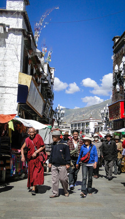 Tibet, China - Sep 7, 2012. People walk around Jokhang temple in Tibet. Tibetans, in general, consider Jokhang as the most sacred and important temple in Tibet.のeditorial素材