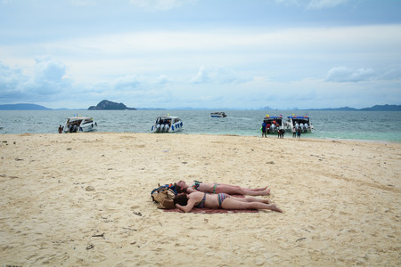 Krabi, Thailand - Jun 20, 2016. Tourists sunbathing on beach in Krabi, Thailand. Krabi is the main town in the province of Krabi on the west coast of southern Thailand.のeditorial素材