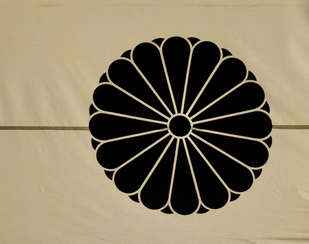 Dharma Wheel Buddhist symbol on flag at temple in Nagano, Japan.
