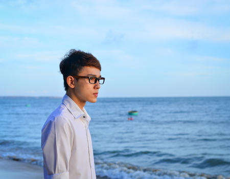 Portrait of Asian man on the beach at summer day in Southern Vietnam.の写真素材