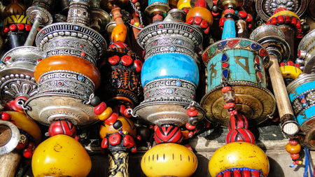 Tibet, China - Sep 7, 2012. Prayer wheels at flea market in Lhasa, Tibet. Lhasa is a prefecture-level city, one of the main administrative divisions of Tibet.のeditorial素材
