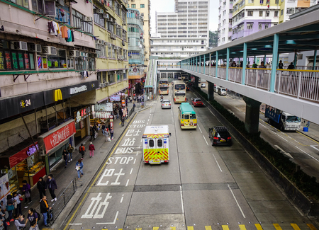 Hong Kong - Mar 29, 2017. Traffic on street at Kowloon District in Hong Kong, China. Hong Kong has a free market economy, highly dependent on international trade and finance.のeditorial素材