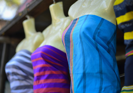 Colorful textile for sale at a traditional market in Yangon, Myanmar.の写真素材