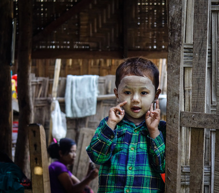 Mandalay, Myanmar - Feb 11, 2017. Portrait of a cute boy with thanaka on face in Mandalay, Myanmar. Mandalay is the second-largest city and the last royal capital of Burma.のeditorial素材