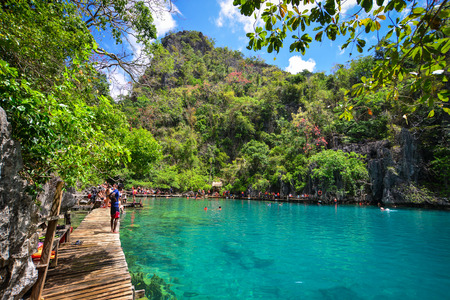 Coron, Philippines - Apr 9, 2017. People enjoy on Barracuda Lake in Coron Island, Philippines. Coron is a beautiful island with trees, mangroves, white sand beach and a reef.のeditorial素材