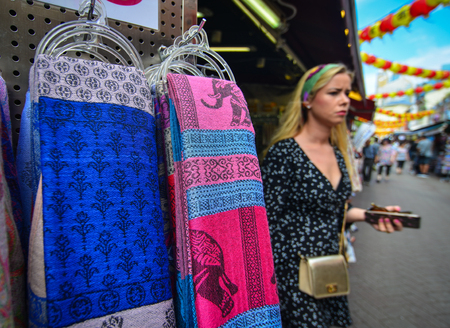 Singapore - Jun 12, 2017. Selling textile on street of Chinatown district in Singapore. Singapore Chinatown is a world famous bargain shopping destination.のeditorial素材