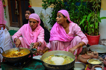 Jodhpur, India - Nov 6, 2017. Women cooking traditional food on street in Jodhpur, India. Jodhpur is a popular tourist destination, featuring many palaces, forts and temples.のeditorial素材