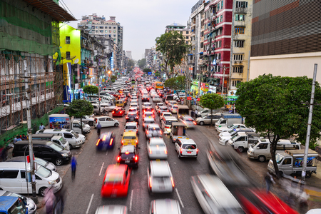 Yangon, Myanmar - Feb 1, 2017. Cars running on main street at twilight in Yangon, Myanmar. Yangon is Myanmar largest city and its most important commercial centre.のeditorial素材
