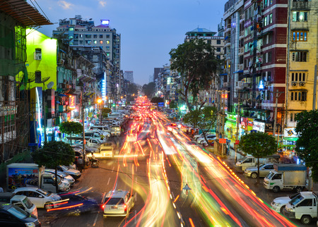 Yangon, Myanmar - Feb 1, 2017. Cars running on main street at night in Yangon, Myanmar. Yangon is Myanmar largest city and its most important commercial centre.のeditorial素材
