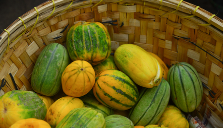 Selling fresh melons at local market in Yangon, Myanmar.の写真素材
