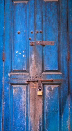 Blue wooden door of old building in Yangon, Myanmar.の写真素材