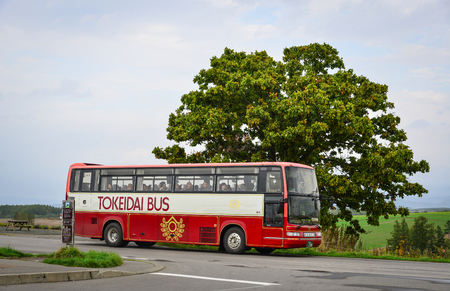 Biei, Japan - Oct 2, 2017. A tourist bus in Biei, Hokkaido, Japan. Biei is a small town surrounded by a picturesque landscape of gently rolling hills and vast fields.のeditorial素材