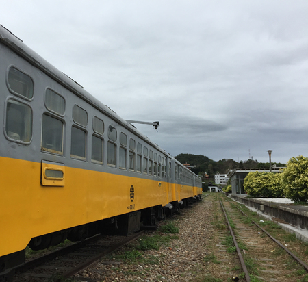 Taichung, Taiwan - Mar 11, 2015. Yellow old train at railway station in Taichung, Taiwan. There are...