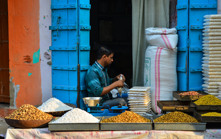 Pushkar, India - Nov 5, 2017. Selling nuts in Pushkar, India. Pushkar is a town in the Ajmer district in the state of Rajasthan. It is a pilgrimage site for Hindus and Sikhs.のeditorial素材