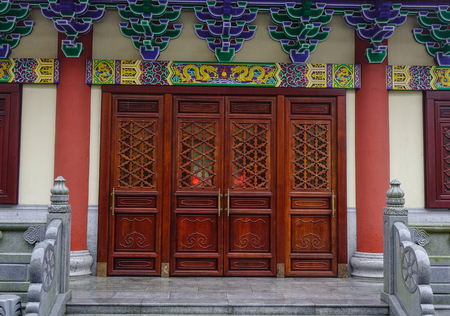 Wooden door of a Chinese temple in Kowloon District, Hong Kong.の写真素材