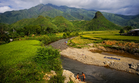 Sapa, Vietnam - Sep 25, 2016. Children bathing on the river in Sapa, Vietnam. Sapa is famous for terraced fields at the foot of magnificent Fansipan mountain.のeditorial素材