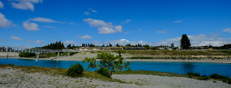 Lake Tekapo at sunny day in New Zealand. The lake covers an area of 83 square kilometres, and is at an altitude of 710 metres above sea level.の写真素材