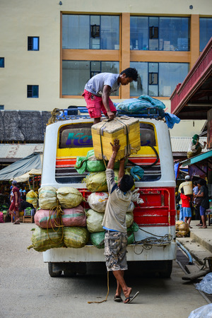 Coron, Philippines - Apr 4, 2017. People loading goods to the bus in Coron Island, Philippines. Coron is the third-largest island in the Calamian Islands in northern Palawan.のeditorial素材