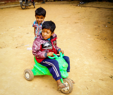Highlands, Vietnam - Dec 5, 2015. Children playing at mountain village in Central Highlands, Vietnam. The Highlands is a plateau bordering the lower part of Laos and Cambodia.のeditorial素材