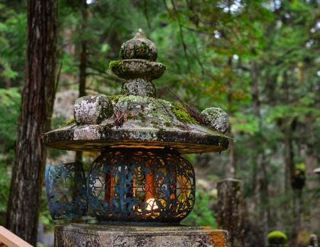 An ancient lantern on Mt. Koya in Wakayama, Japan. Mount Koya (Koya-san in Japanese) is one of Japan most sacred mountains.のeditorial素材