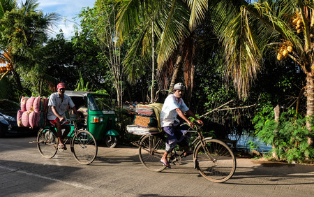 Colombo, Sri Lanka - Sep 5, 2015. People biking on rural road in Colombo, Sri Lanka. Colombo is the...