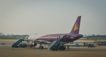 Saigon, Vietnam - Dec 6, 2017. A civil aircraft docking at Tan Son Nhat Intl Airport in Saigon, Vietnam. Tan Son Nhat is the busiest airport in Vietnam with 32.5 million passengers.のeditorial素材