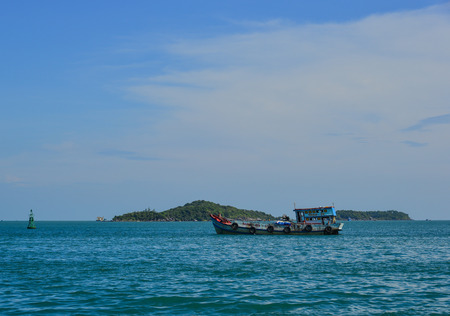 Phu Quoc, Vietnam - Dec 7, 2017. A wooden boat running on the sea in Phu Quoc, Vietnam. Phu Quoc is an island off the coast of Cambodia in the Gulf of Thailand.のeditorial素材