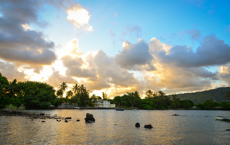 Sunset on the sea with palm trees in Mahebourg, Mauritius.の写真素材