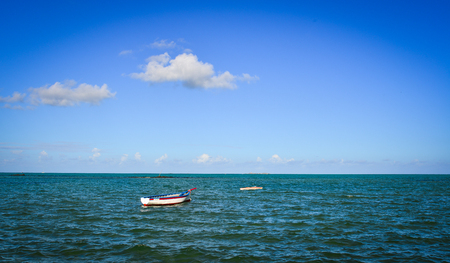 A small boat on the sea at sunny day in Mahebourg, Mauritius.の写真素材